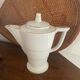 White and gold porcelain coffee pot in art deco style.