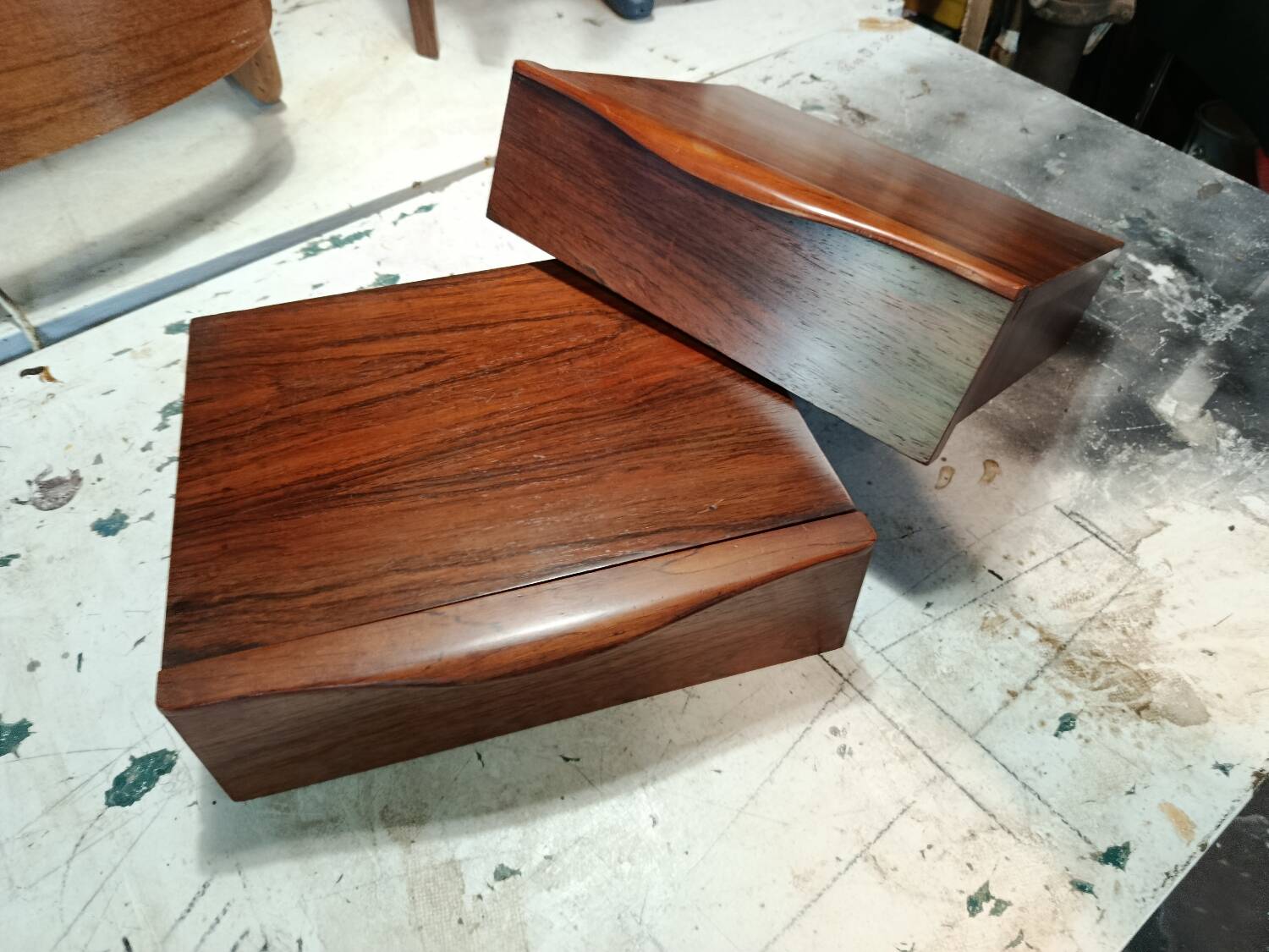 Scandinavian suspended bedside tables in rosewood.