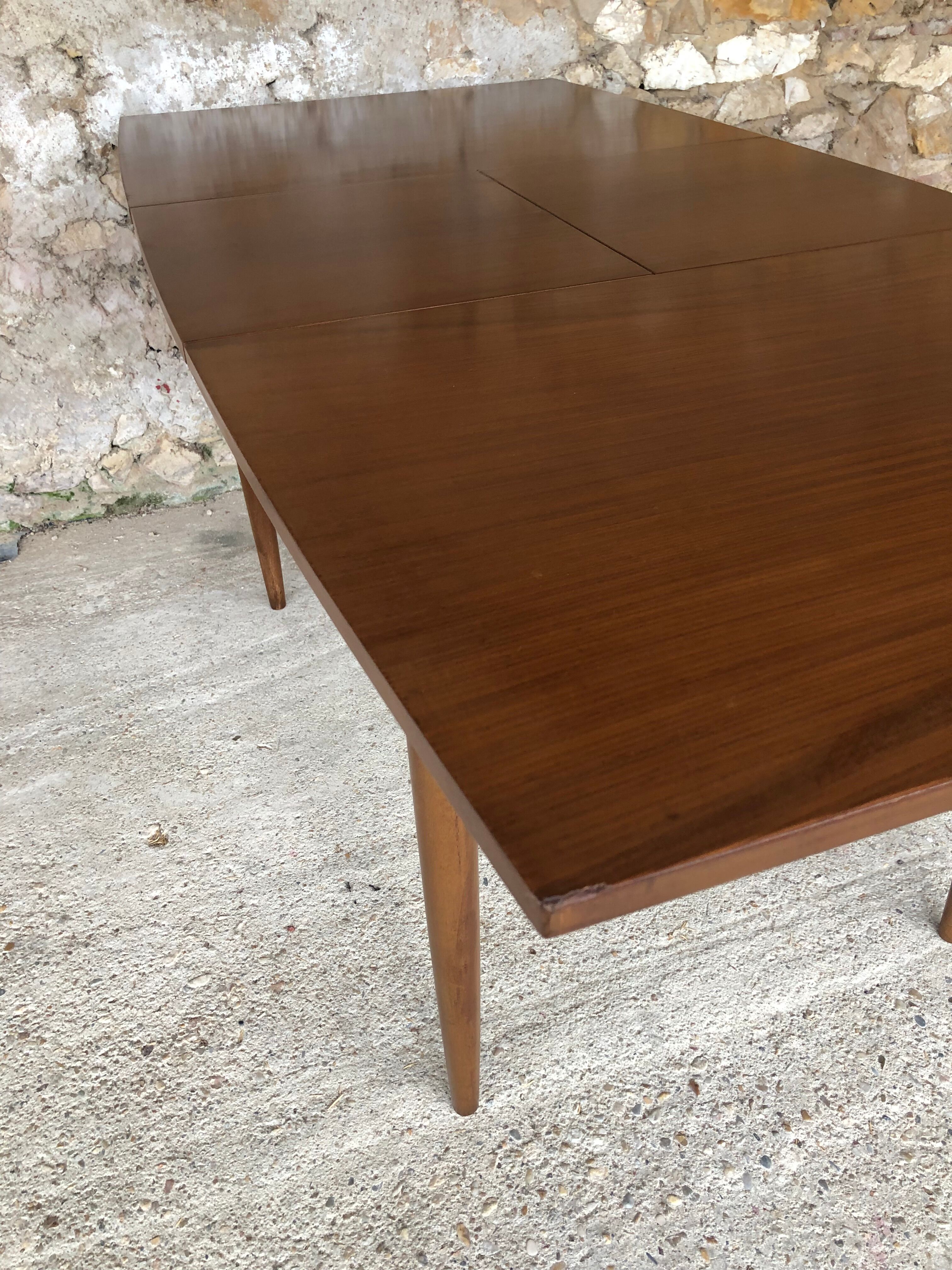 Scandinavian extension teak stretch table in butterfly ephardt by Meredew circa 60's