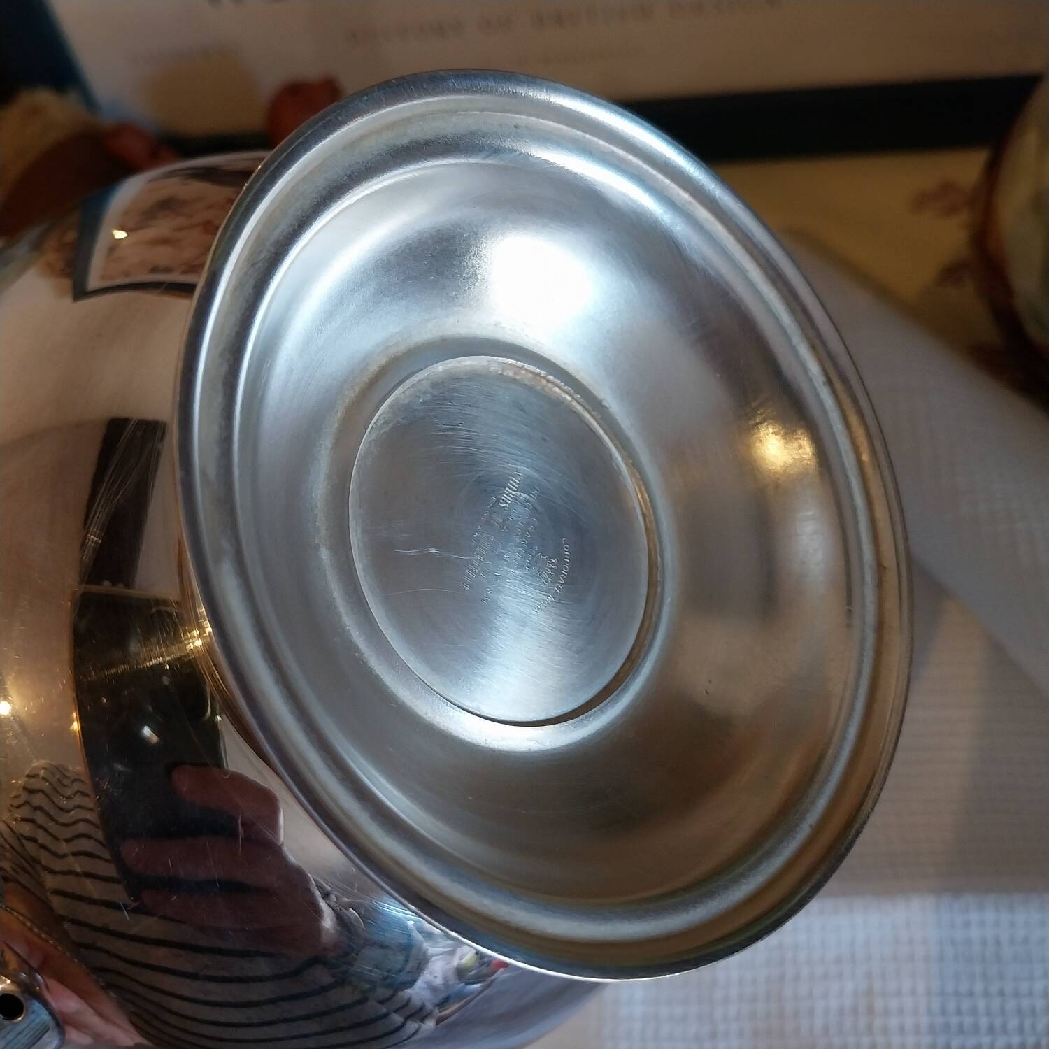 Old English teapot in silver-plated metal and Bakelite.