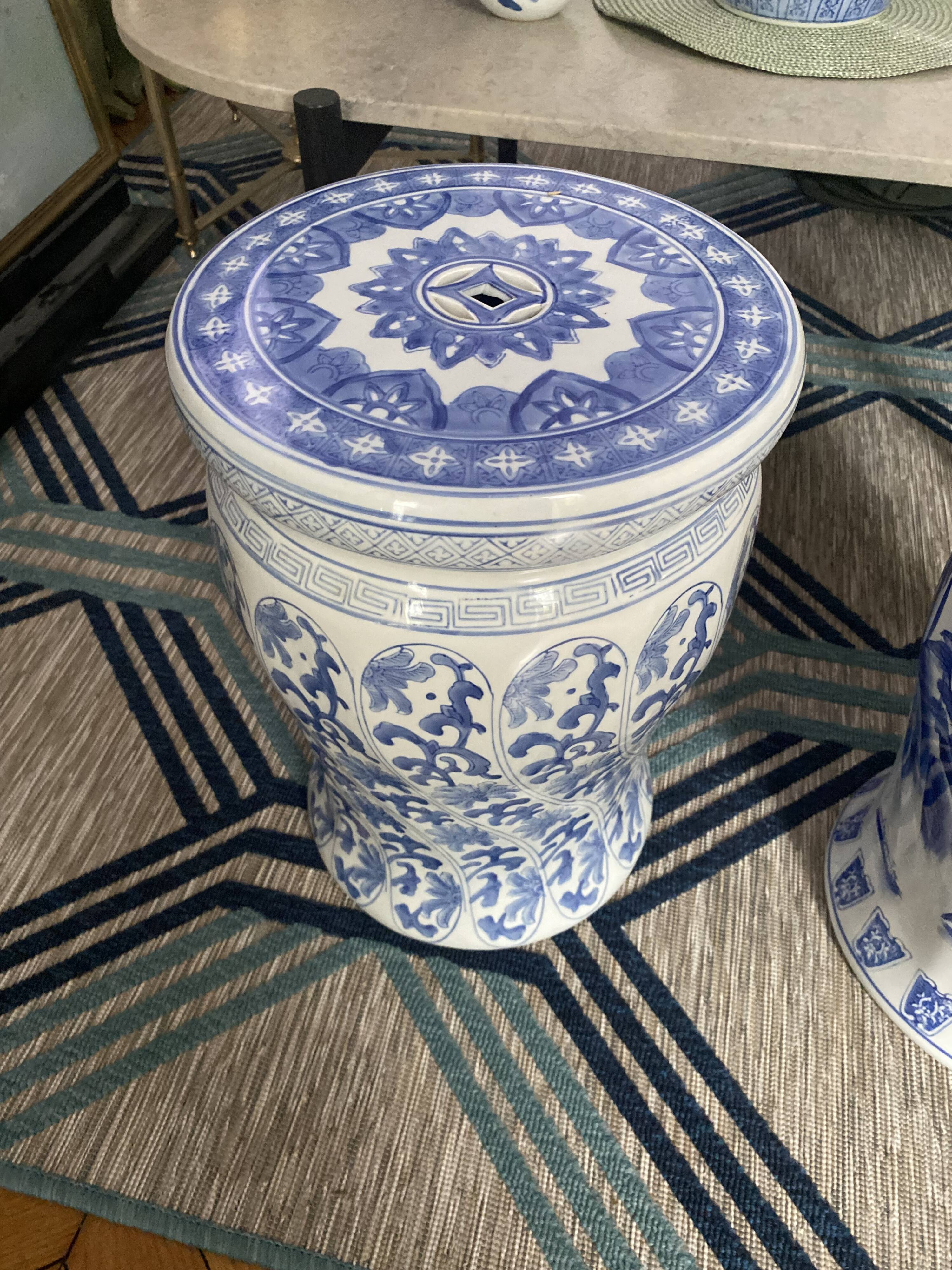 Set of two white and blue porcelain side tables.