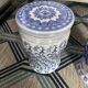 Set of two white and blue porcelain side tables.