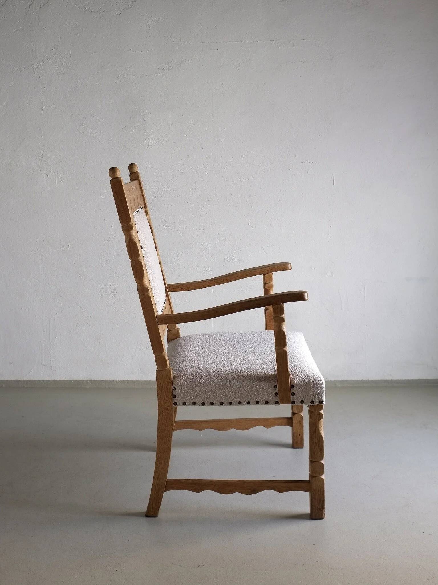 Carved oak armchair by Henning Kjaernulf | Denmark | 1960s