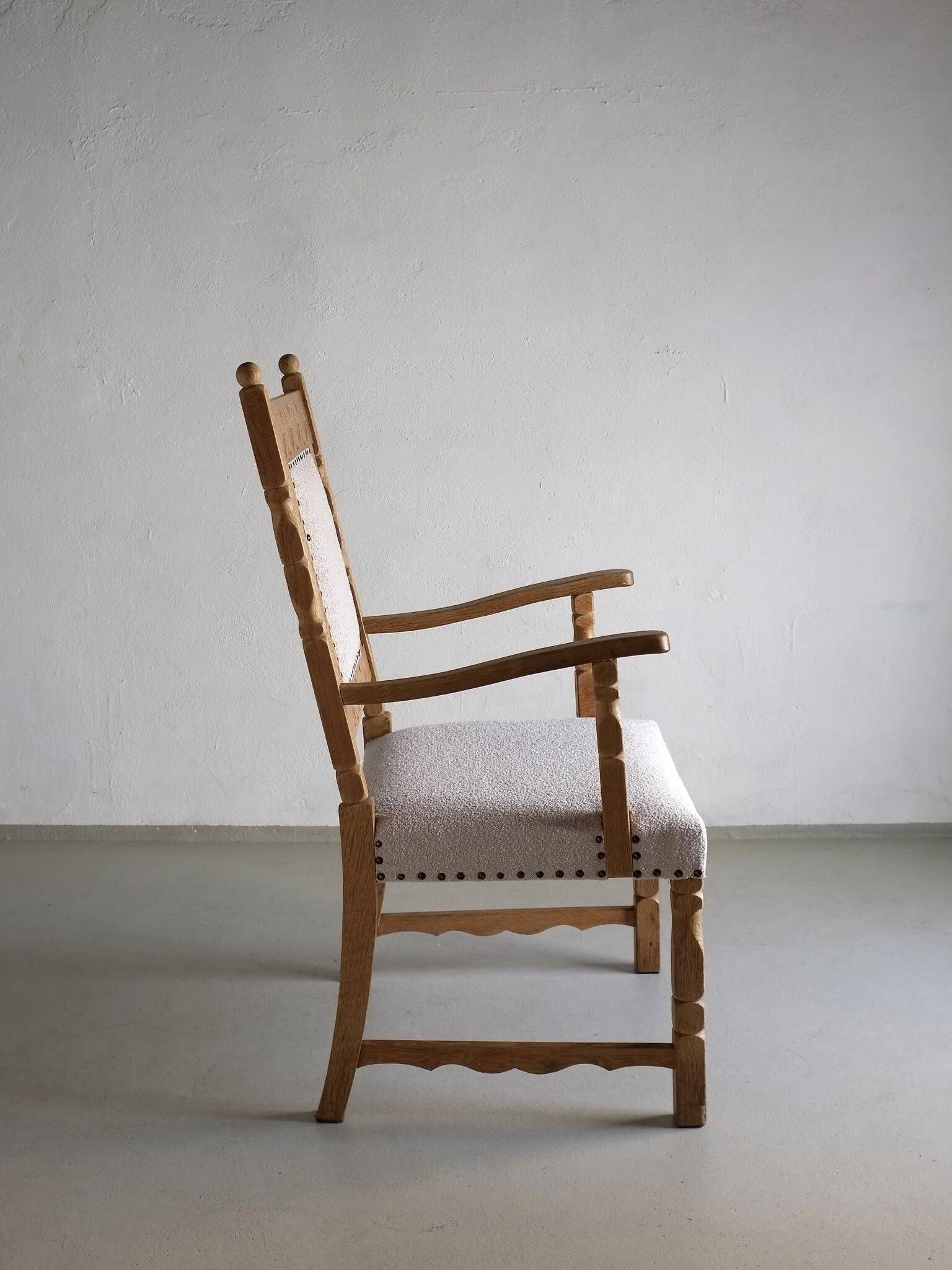 Carved oak armchair by Henning Kjaernulf | Denmark | 1960s