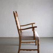 Carved oak armchair by Henning Kjaernulf | Denmark | 1960s