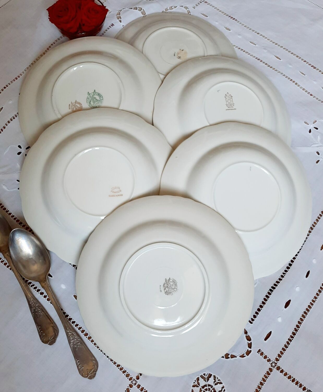 Old hollow plates mismatched in earthenware with gilded edges