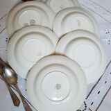 Old hollow plates mismatched in earthenware with gilded edges
