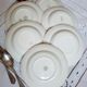 Old hollow plates mismatched in earthenware with gilded edges