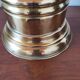 Vintage brass umbrella stand with lion decoration.