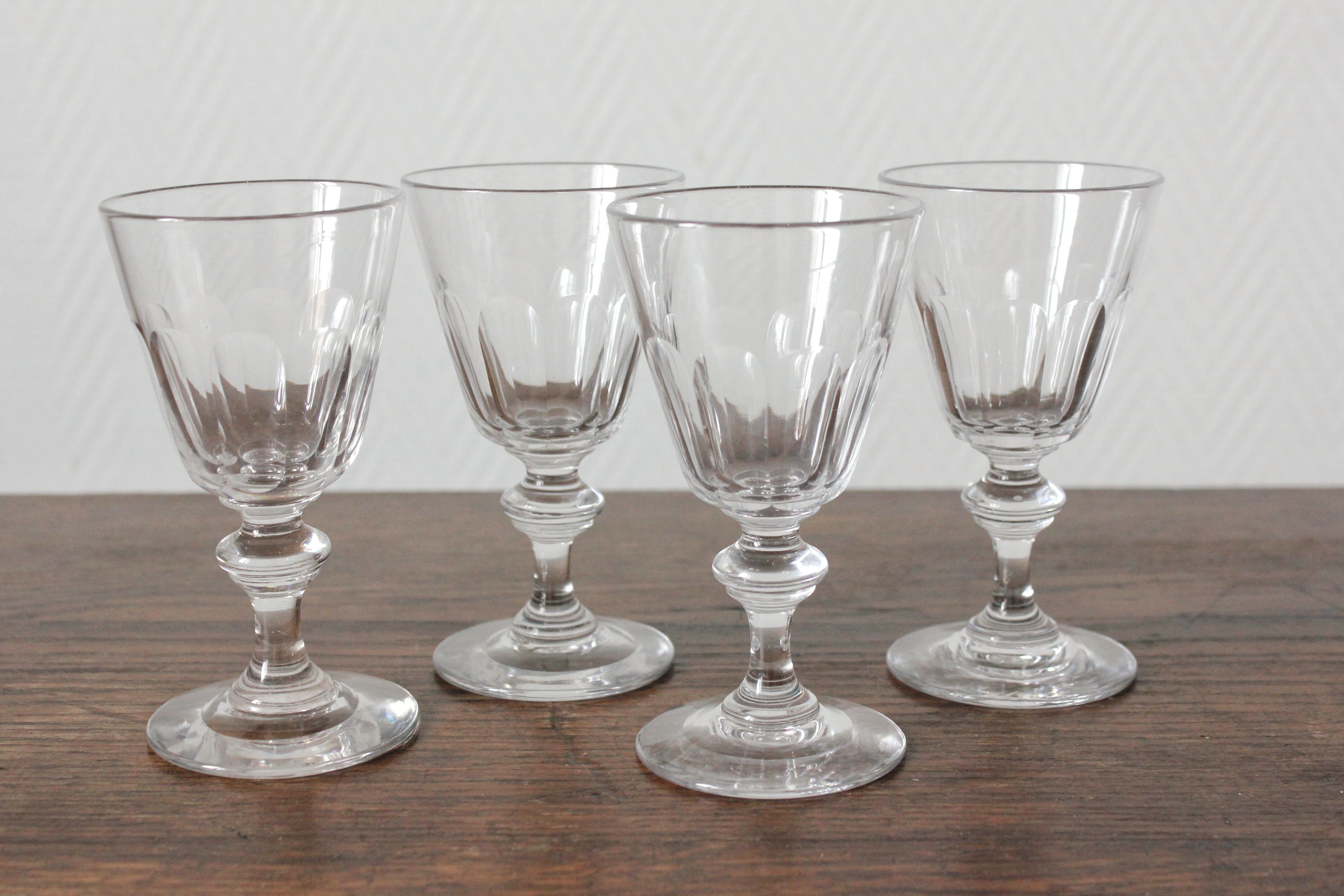 4 glasses with white wine in crystal ringing the nineteenth