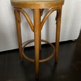 Curved wooden stool and cannage
