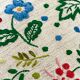 Cushion in hand-embroidered hemp.