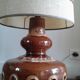 Floor lamp with Fat Lava ceramic foot and fabric lampshade.