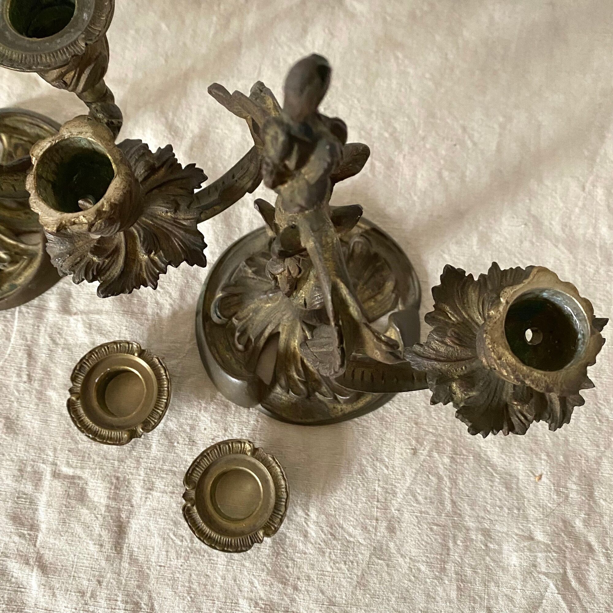 Pair of antique bronze candlesticks at the end of the table XIXth