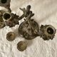 Pair of antique bronze candlesticks at the end of the table XIXth