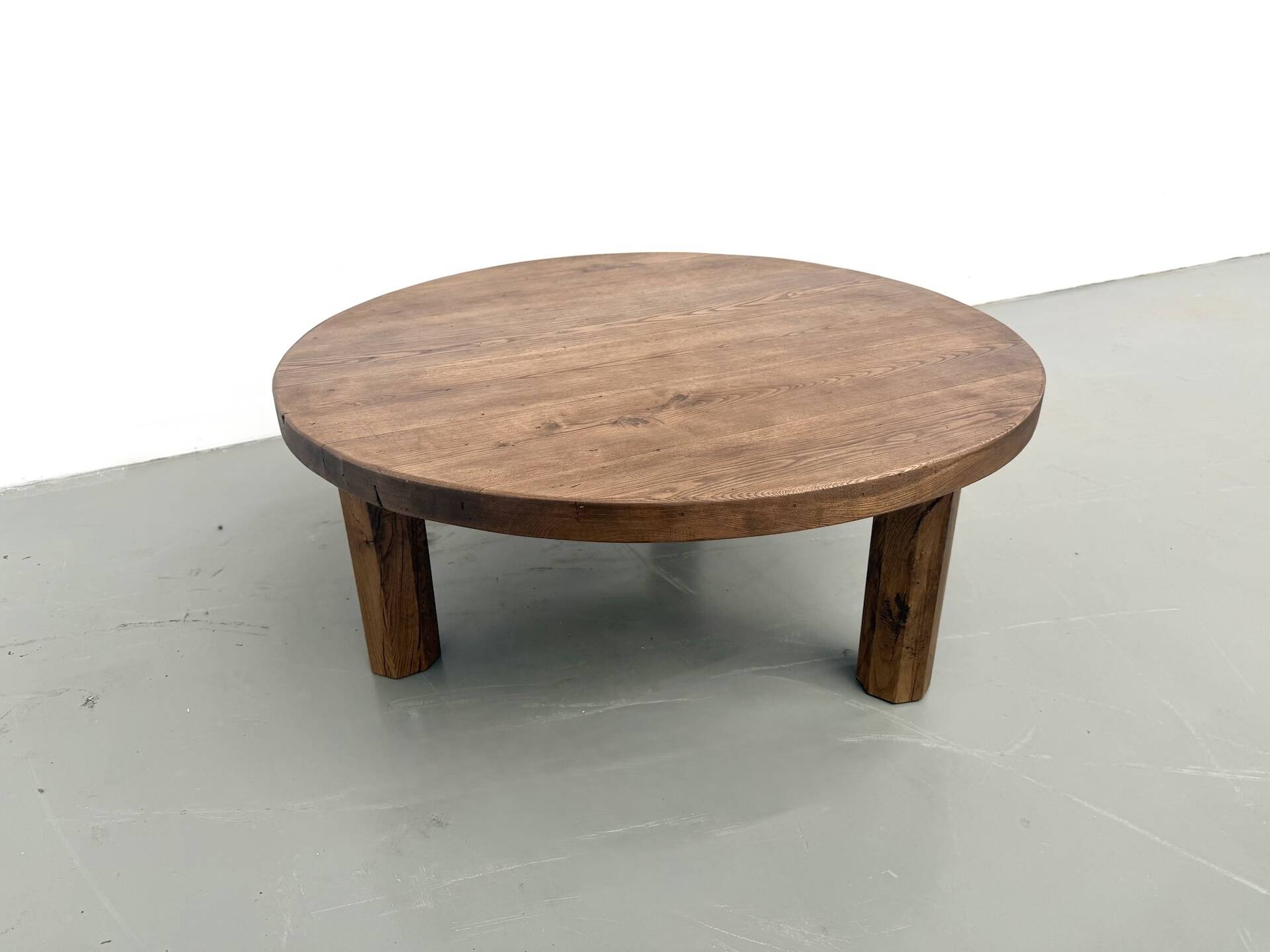 Round coffee table in solid oak, octagonal legs, France, 1950s.
