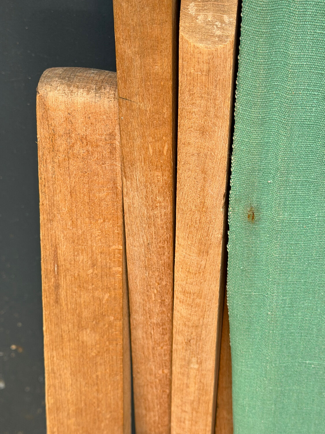 Vintage deck chair with striped green and red fabric, original patina.