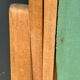 Vintage deck chair with striped green and red fabric, original patina.