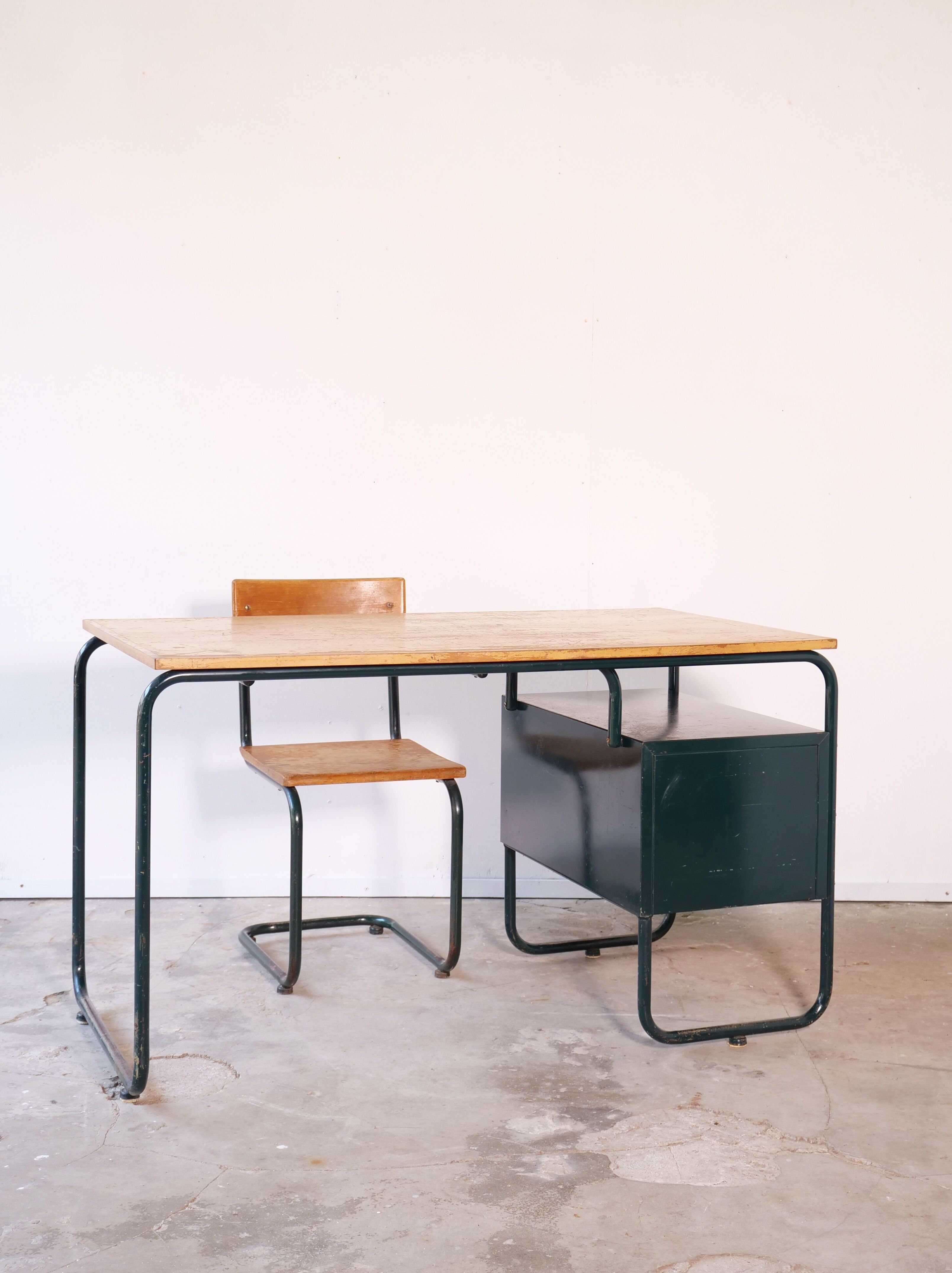 Desk with bauhaus style tubular steel chair