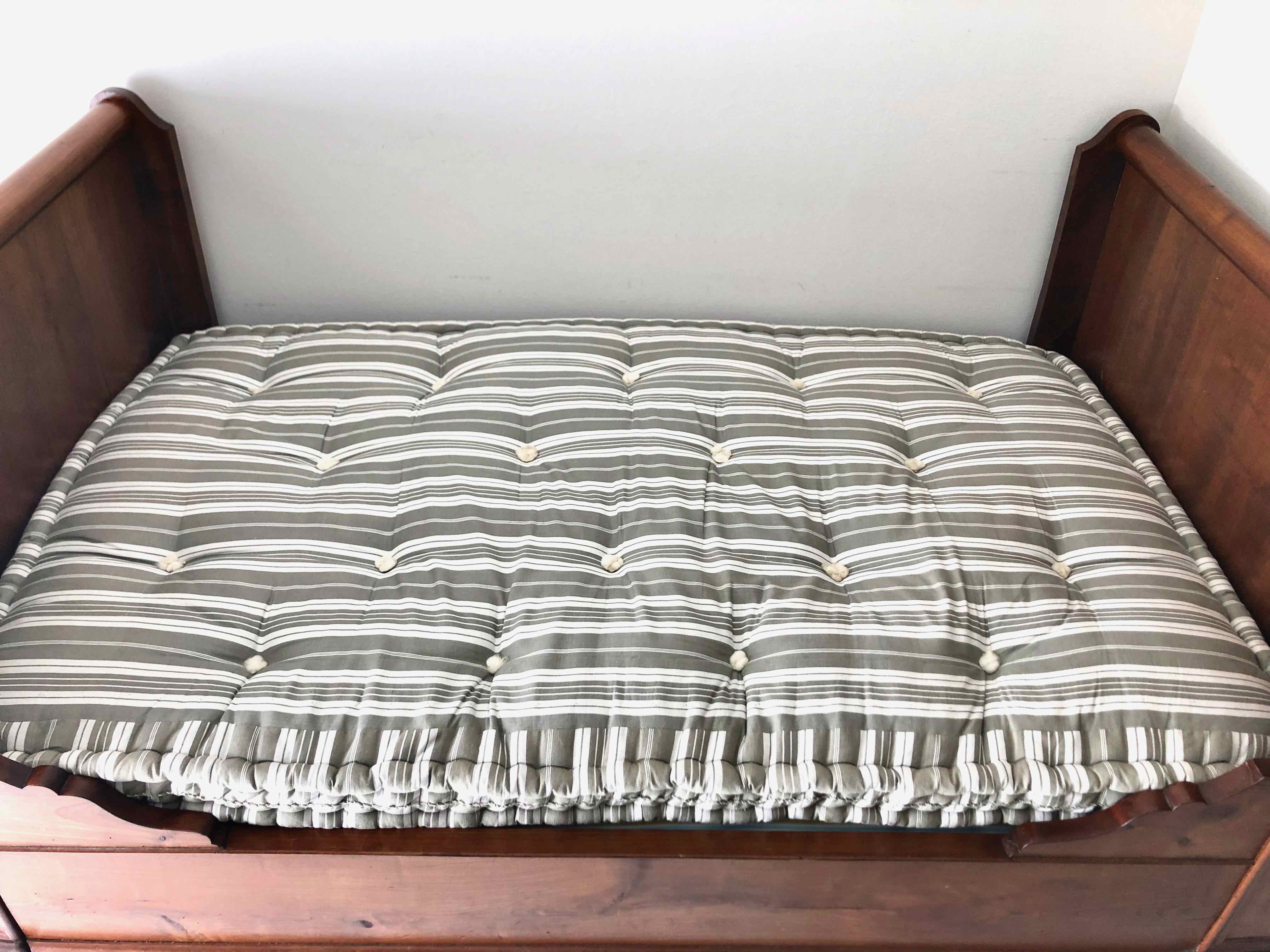 Cherry wood boat bed with bedding