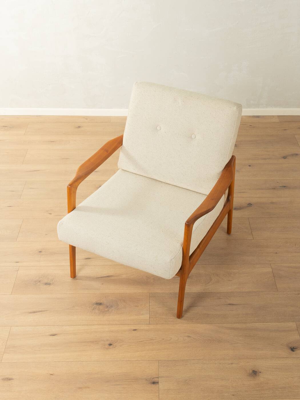 Elegant mid-century armchair from the 1960s with cream-white upholstery