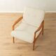 Elegant mid-century armchair from the 1960s with cream-white upholstery