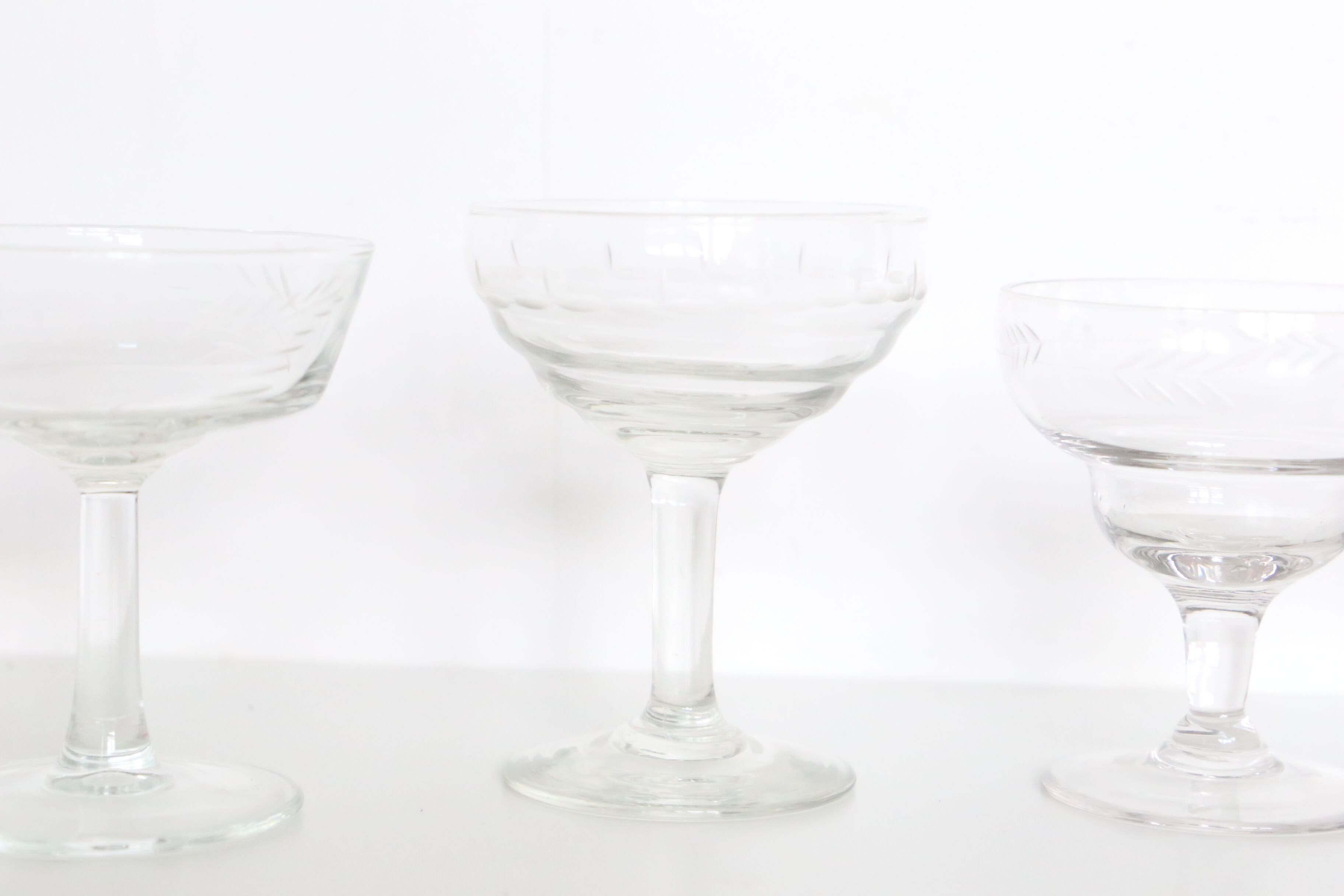 Set of 6 mismatched champagne glasses, chiseled glass