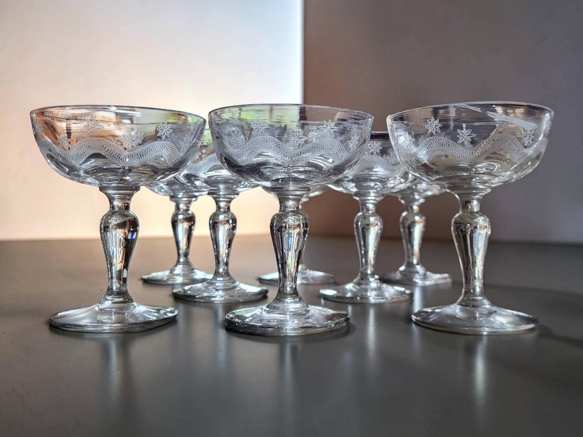 8 engraved glass champagne coupes from Meisenthal, Art Deco