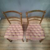 Pair of upholstered chairs in gilded wood