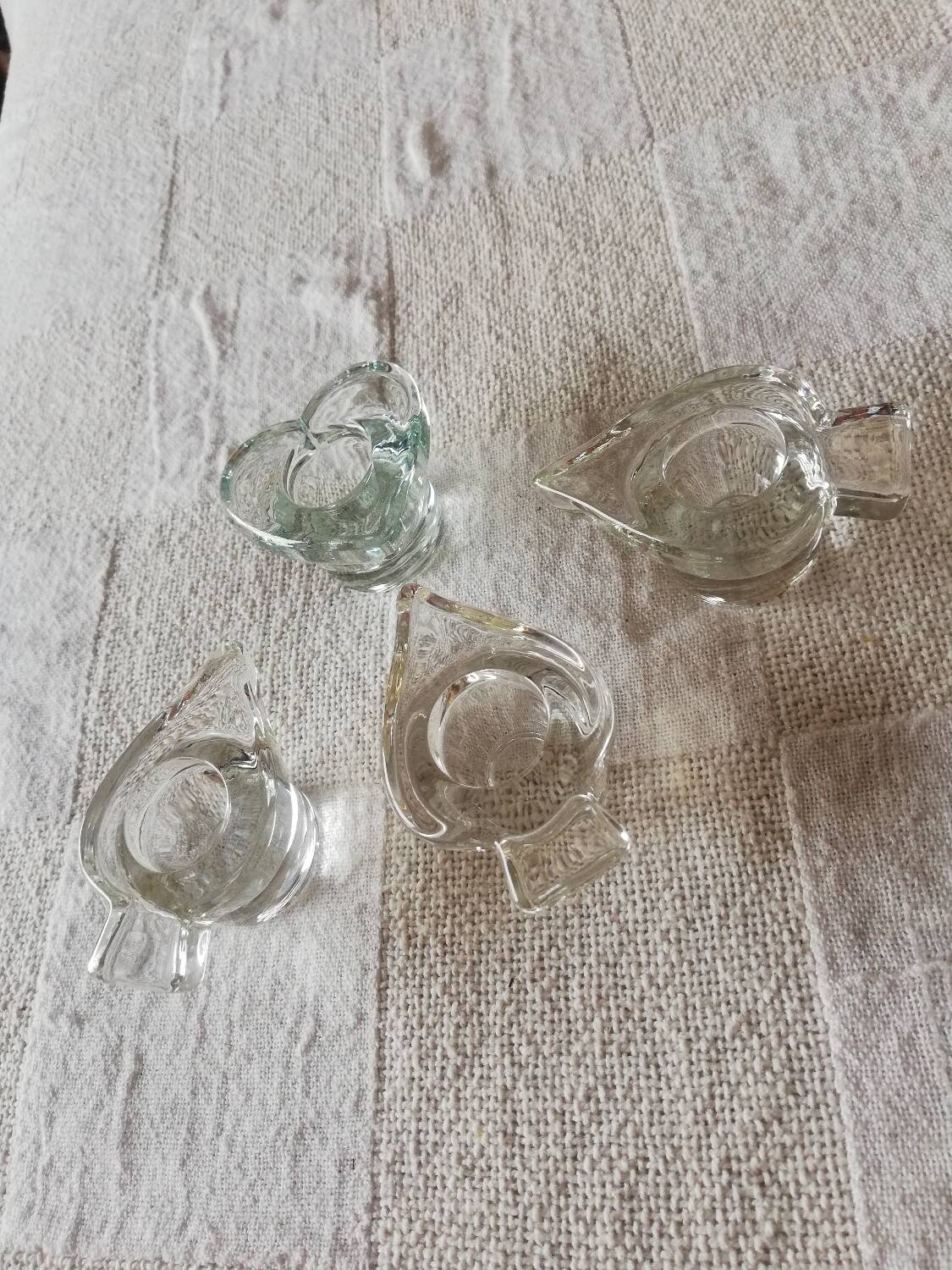 Set of four small transparent glass candle holders 3 spikes 1 heart