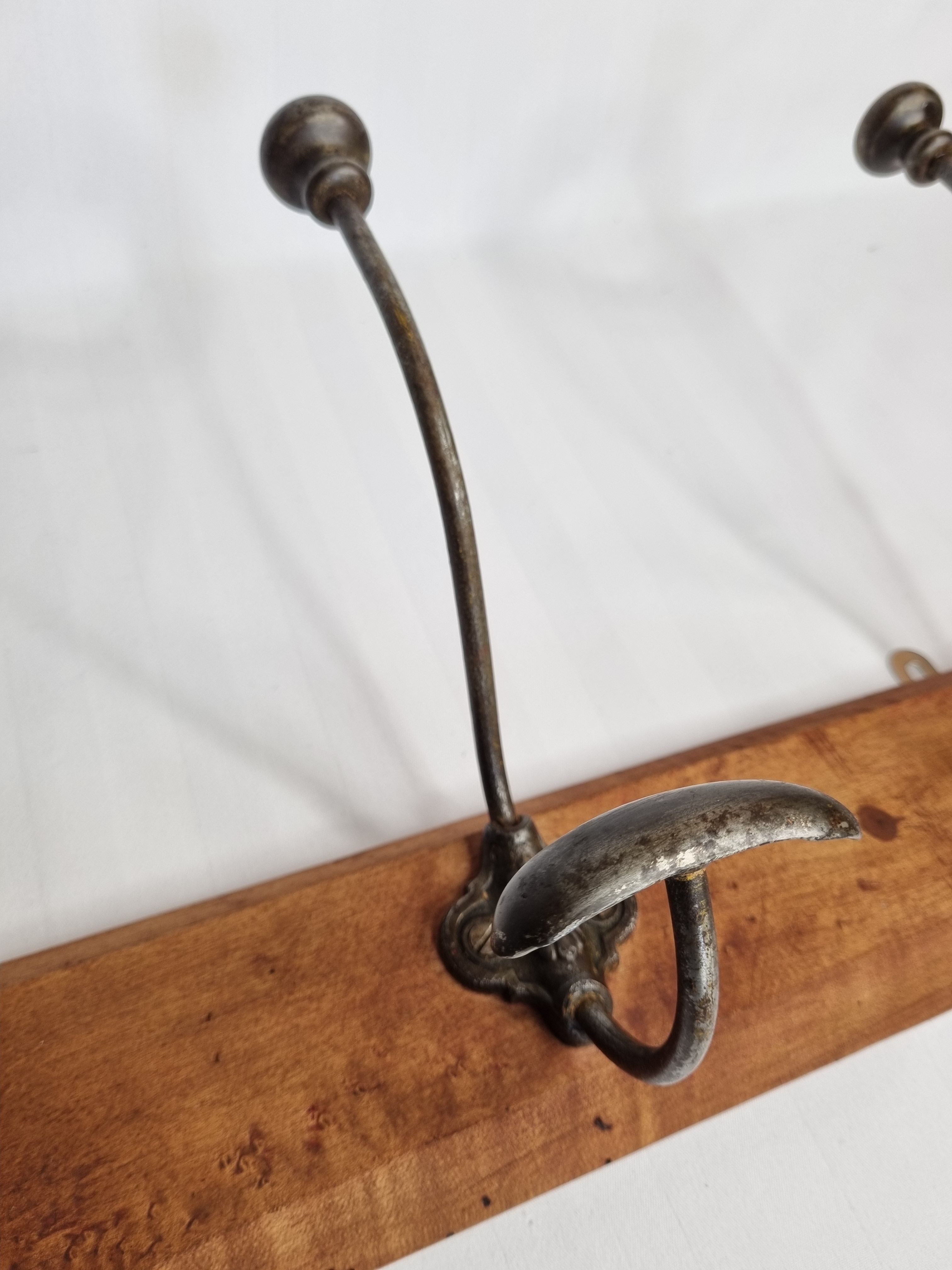 Wall rack "bistro" in metal and wood, 1900, 3 hooks