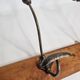 Wall rack "bistro" in metal and wood, 1900, 3 hooks