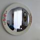Vintage round mirror Syla model 6131 with rose decoration.