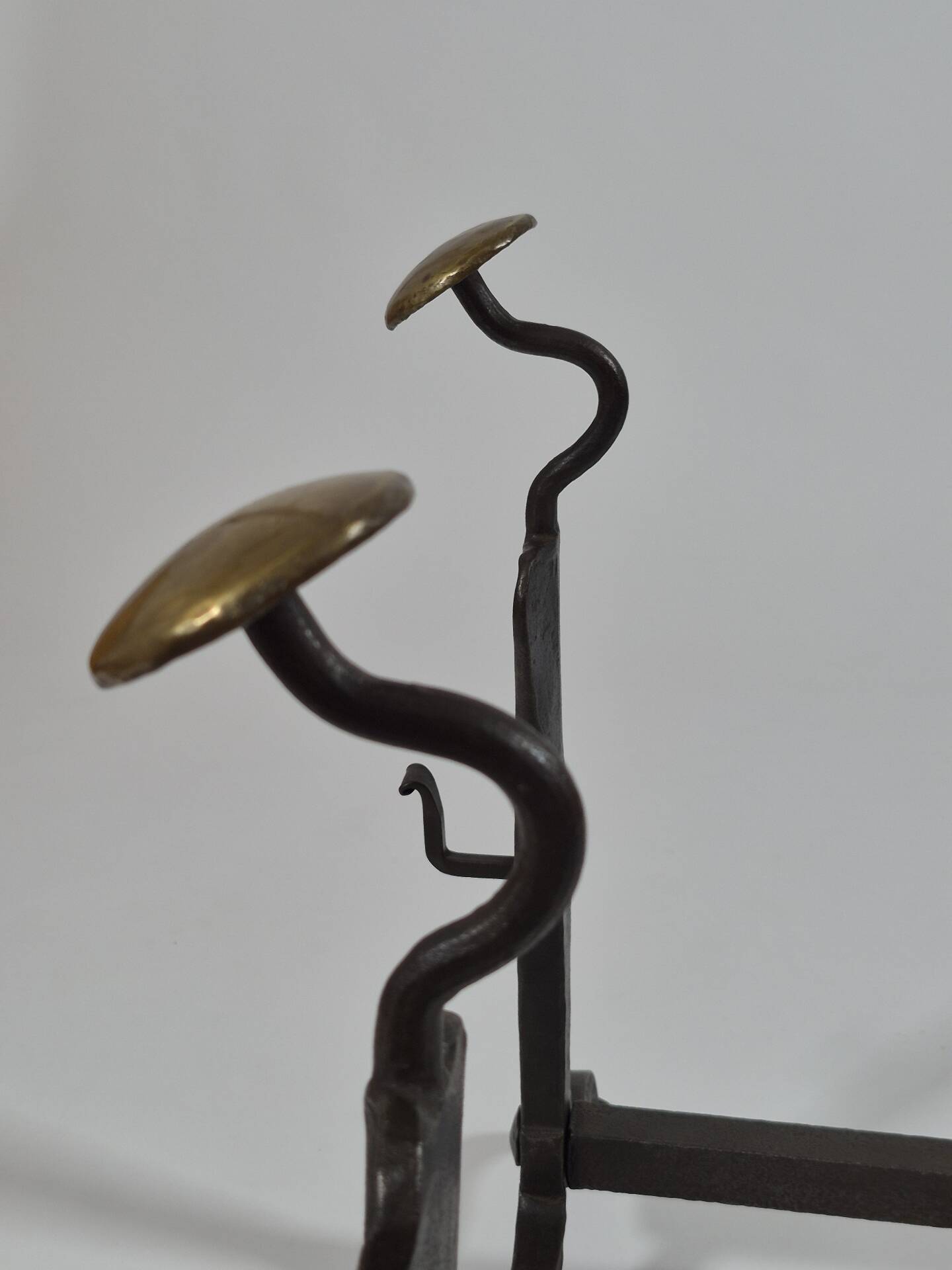 Pair of handforged metal and brass andirons