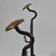 Pair of handforged metal and brass andirons