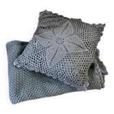 Blue crocheted bedspread and its vintage cushion