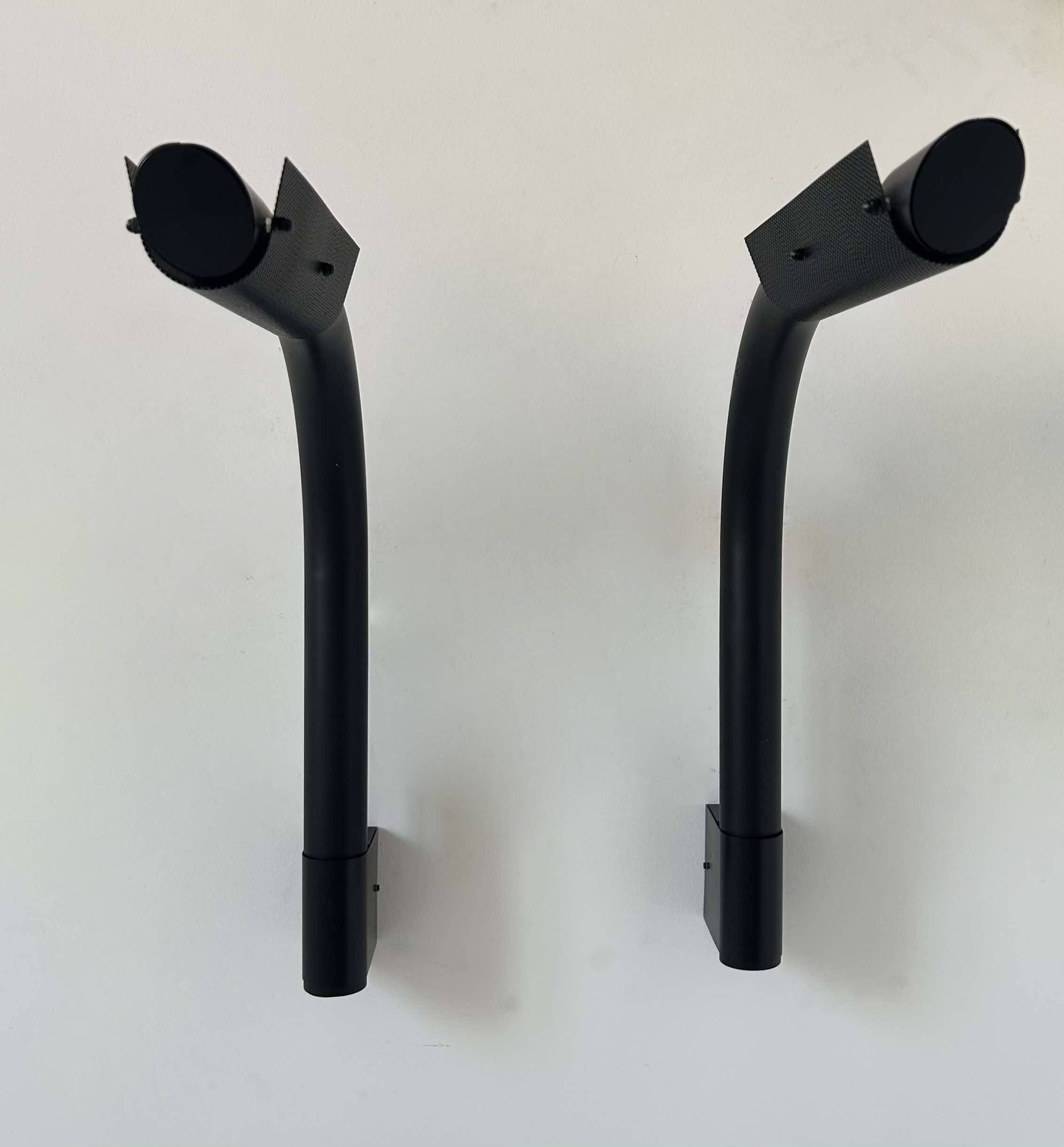 Pair of vintage wall lights, tubular and perforated black metal, Parscot France 1980