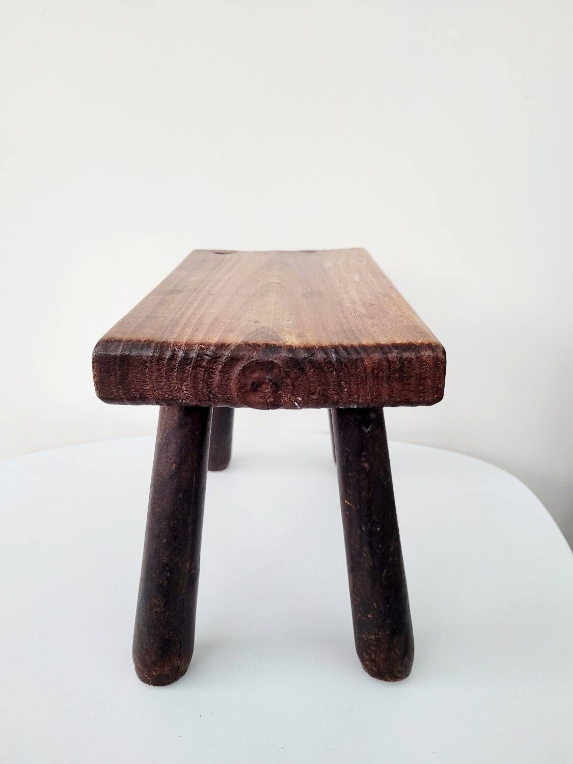 Old small solid wood milking stool