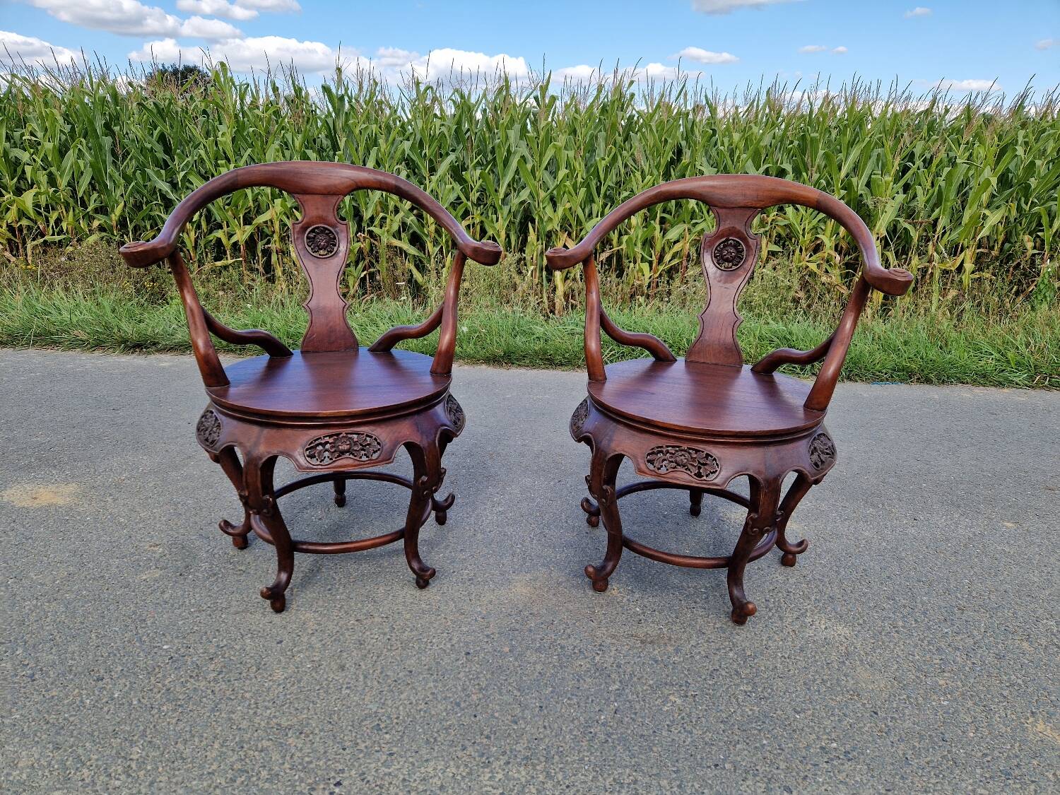 Pair of antique Chinese carved mahogany armchairs, circa 1960s