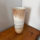 Large hand-blown glass vase in brown and beige.