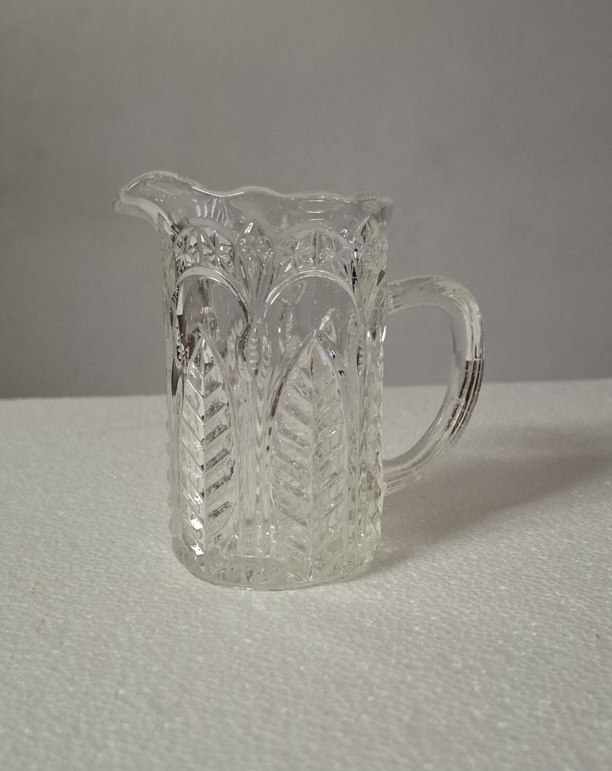 Moulded glass cream pot