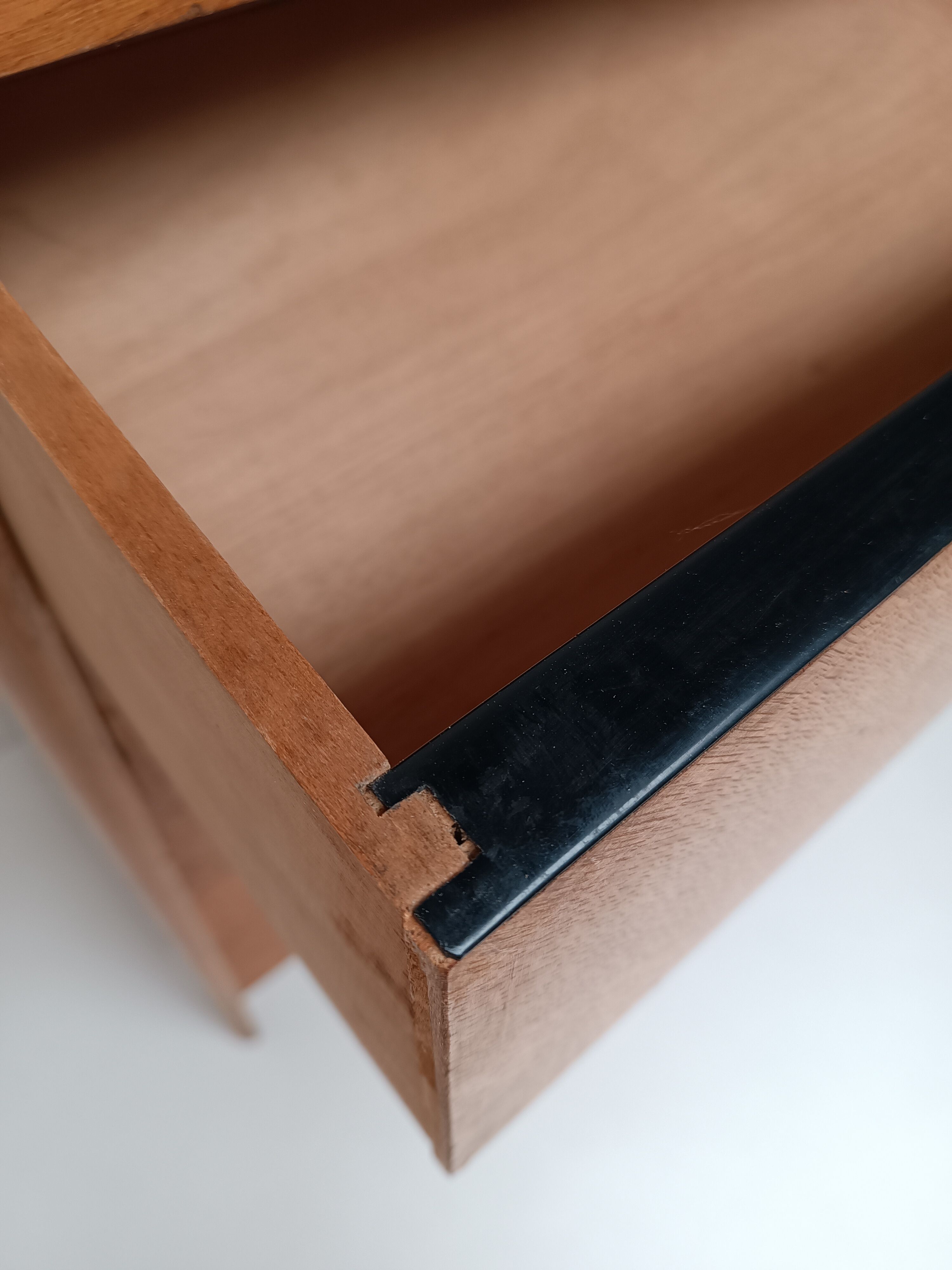 High wooden chest of drawers in the 50s