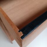 High wooden chest of drawers in the 50s