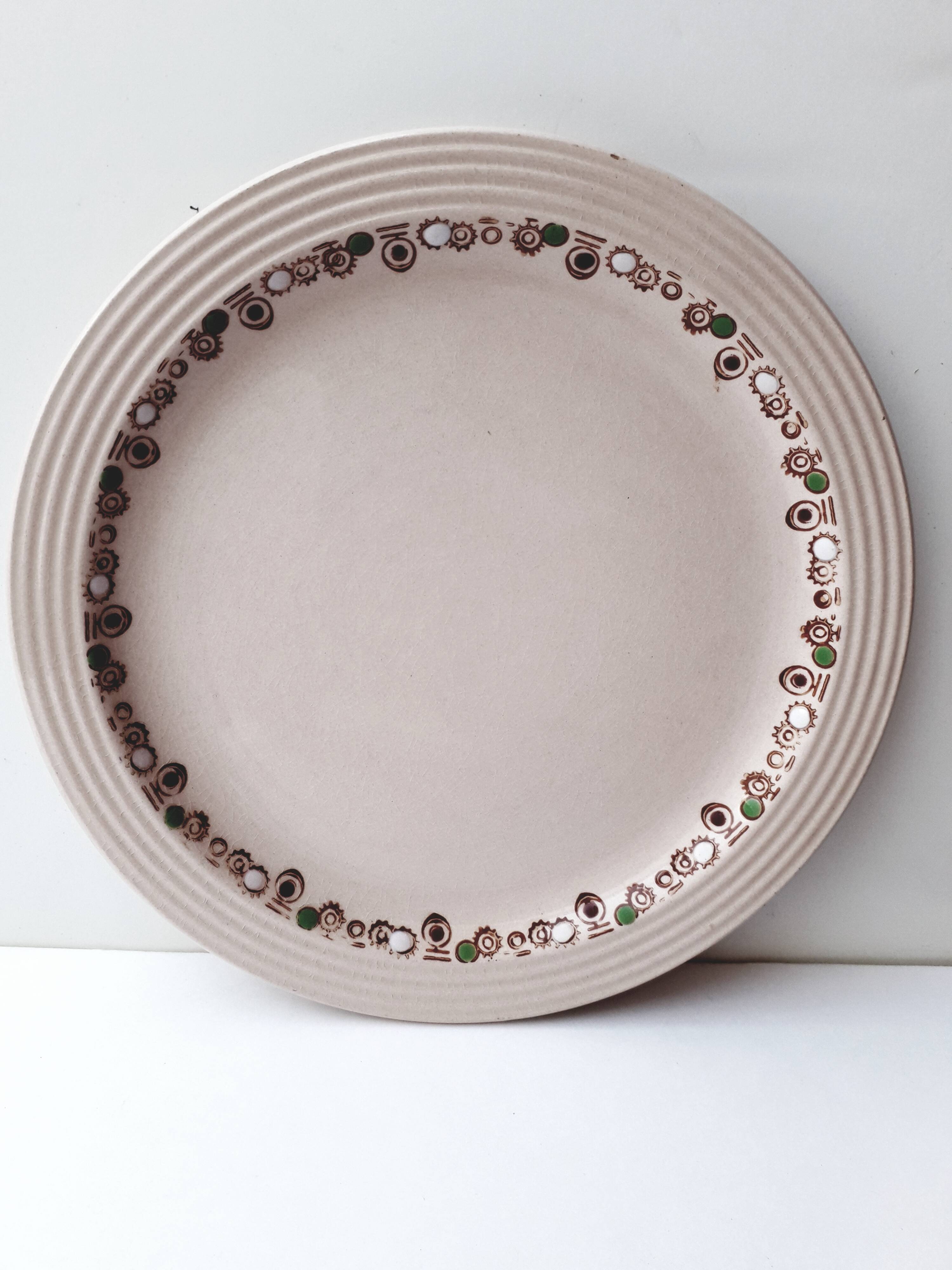 Set of 7 Betty Longwy model plates with floral decoration