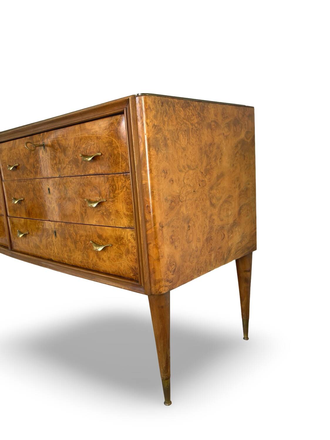 Veneered burl walnut chest of drawers with light warm brown glass top
