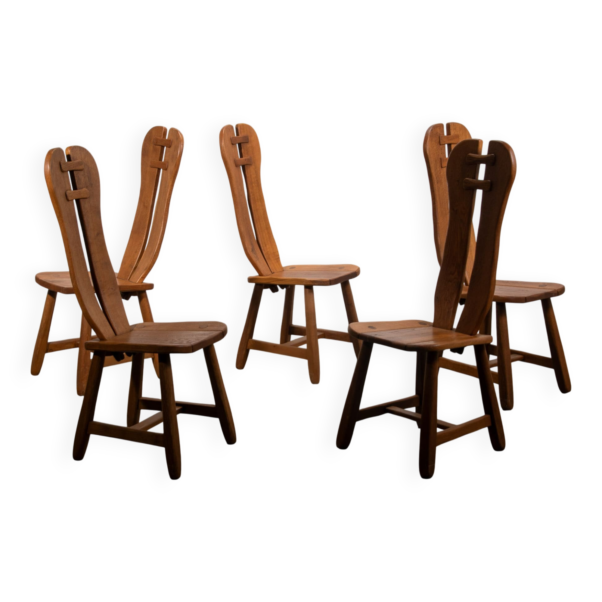 De Puydt brutalist dining chairs in solid oak. Circa 1970.
