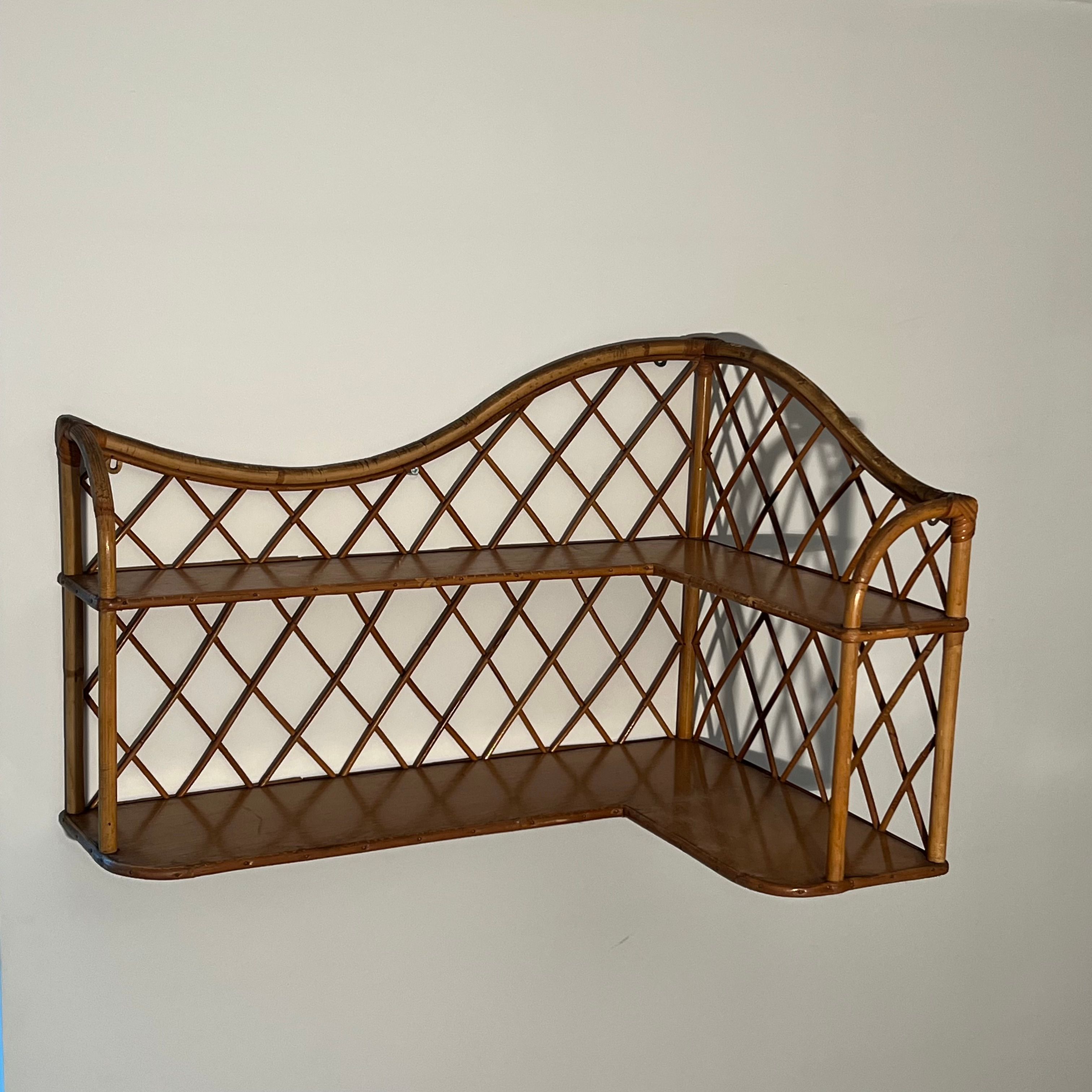 Corner wall shelf in rattan attributed to Audoux-Minet.