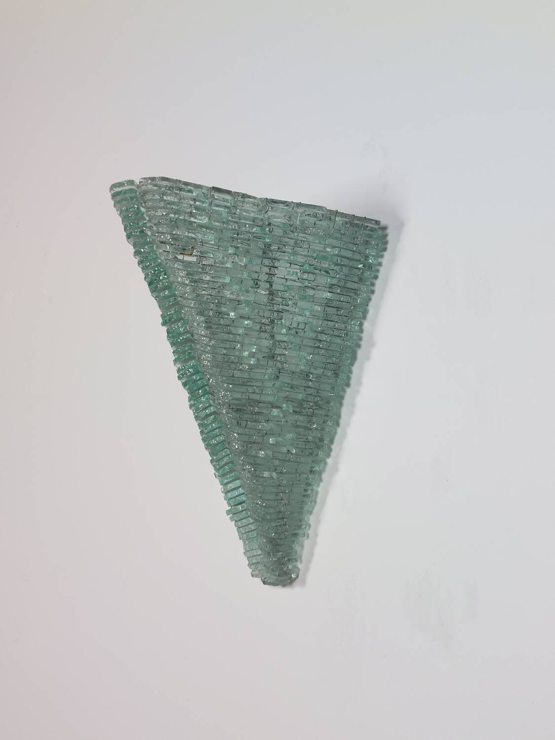 Pair of pyramid-shaped wall sconces in glass in vintage French style.