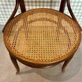 Baumann armchair in curved wood and canework
