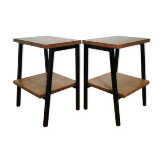 A pair of bedside tables